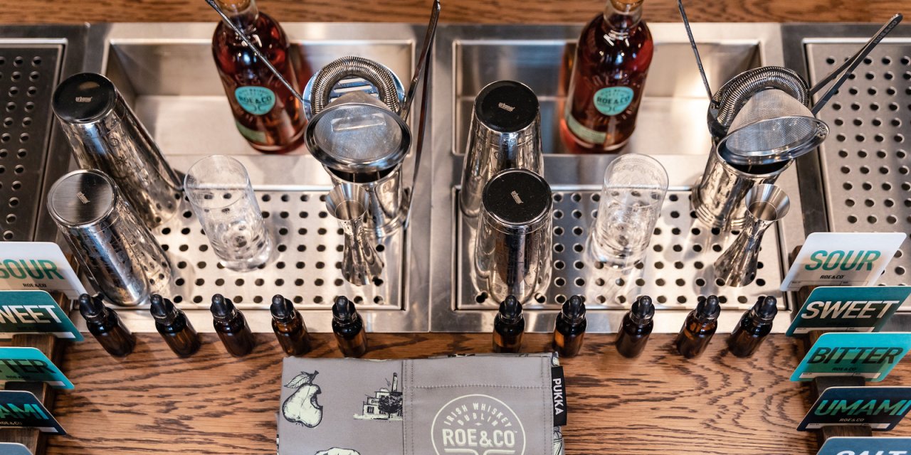 whiskey bottles and mixing devices in irish distillery